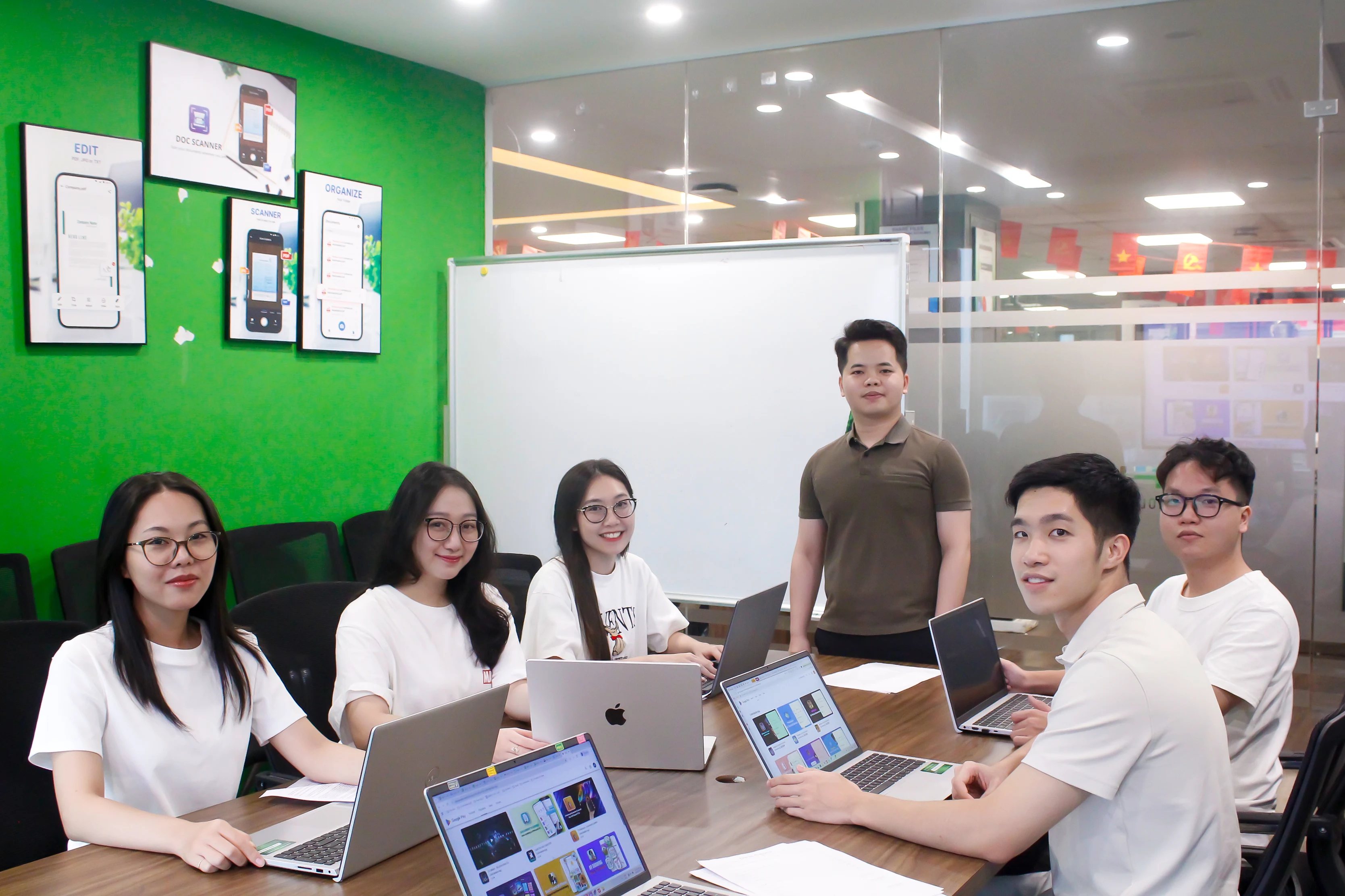 Team collaboration around laptop